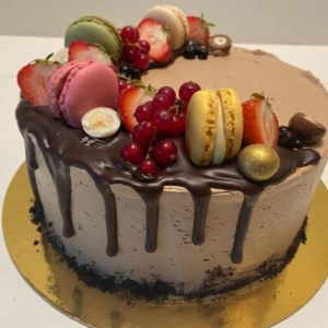 Berries and macarons chocolate cake