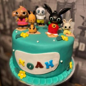 Birthday cake with plastic toys
